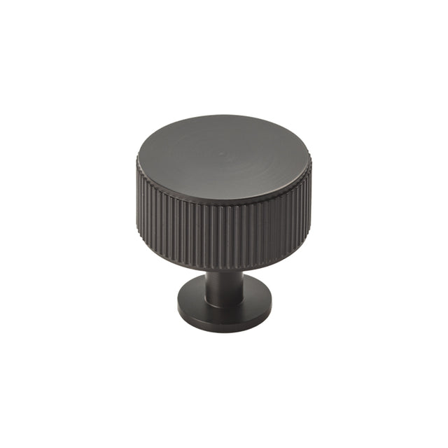 High quality image of Carlisle Brass - Lines Radio Knob - Matt Black | Sku. ftd713mb | Trade Door Handles.