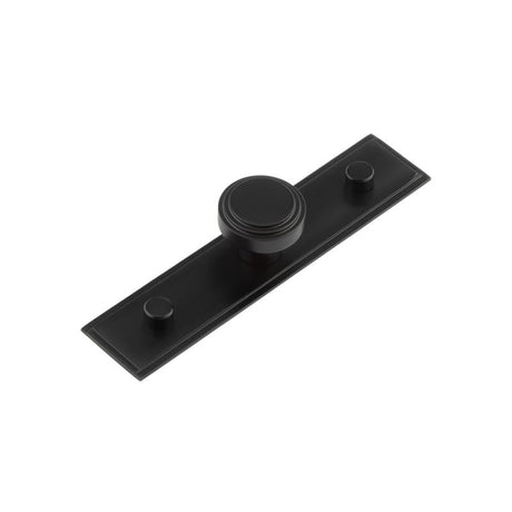 This is an image showing the Frelan - Cropley Cupboard Knobs 30mm Stepped Backplate Black available to order from Trade Door Handles in Kendal