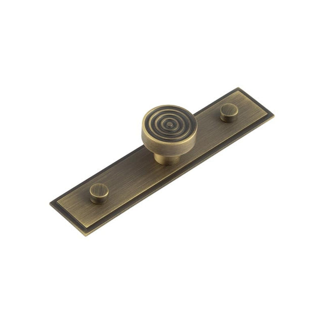 This is an image showing the Frelan - Murray Cupboard Knobs 30mm Stepped Backplate Antique Brass available to order from Trade Door Handles in Kendal