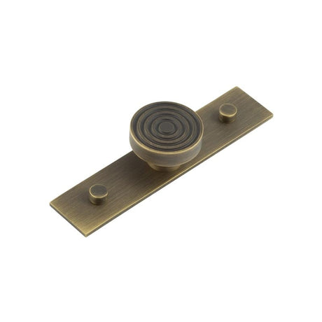 This is an image showing the Frelan - Murray Cupboard Knobs 40mm Plain Backplate Antique Brass available to order from Trade Door Handles in Kendal