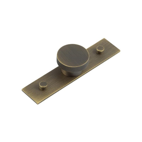 This is an image showing the Frelan - Wenlock Cupboard Knobs 40mm Plain Backplate Antique Brass available to order from Trade Door Handles in Kendal