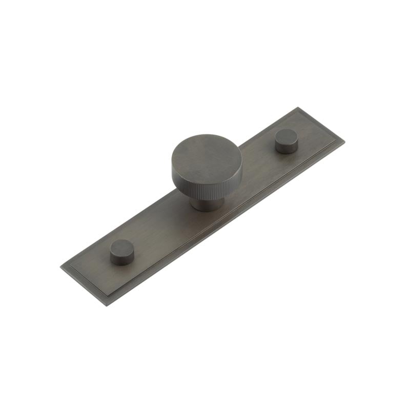 This is an image showing the Frelan - Thaxted Cupboard Knobs 30mm Stepped Backplate Dark Bronze available to order from Trade Door Handles in Kendal