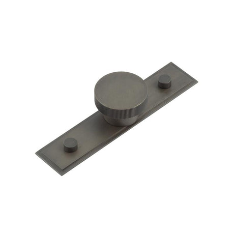 This is an image showing the Frelan - Thaxted Cupboard Knobs 40mm Stepped Backplate Dark Bronze available to order from Trade Door Handles in Kendal