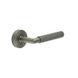 This is an image showing the Frelan - GM Mitred Linear Knurled Lever on Round Rose 316g PVD available to order from Trade Door Handles in Kendal