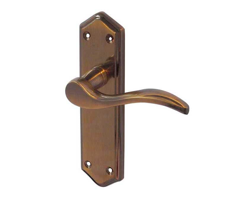 This is an image showing the Frelan - Paris Lever Handles on Backplates - Antique Brass available to order from Trade Door Handles in Kendal