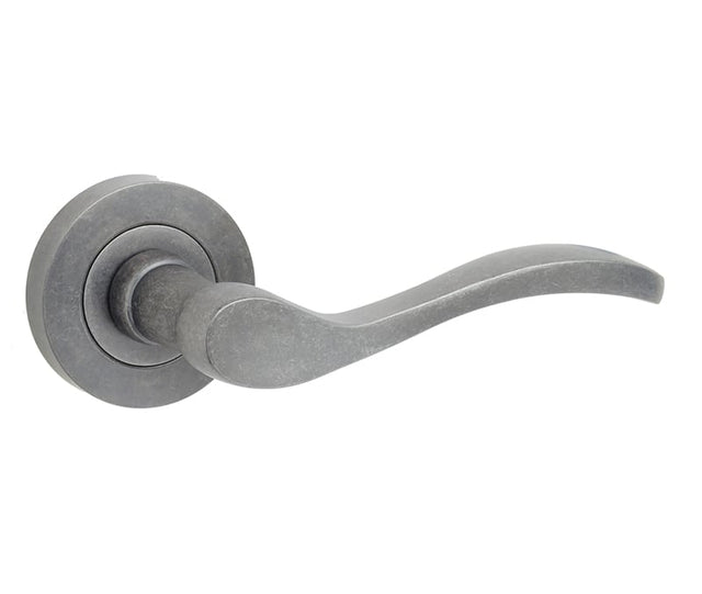 This is an image showing the Frelan - Turin Levers on Round Rose - Rustic available to order from Trade Door Handles in Kendal