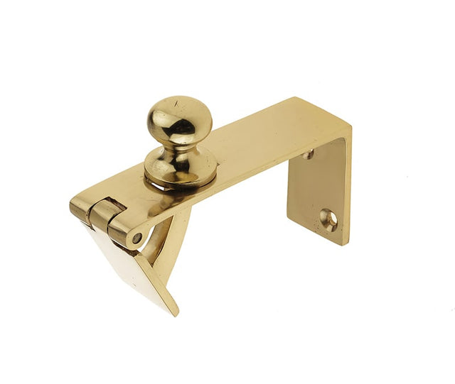 This is an image showing the Frelan - Counter Flap Catch - Polished Brass available to order from Trade Door Handles in Kendal