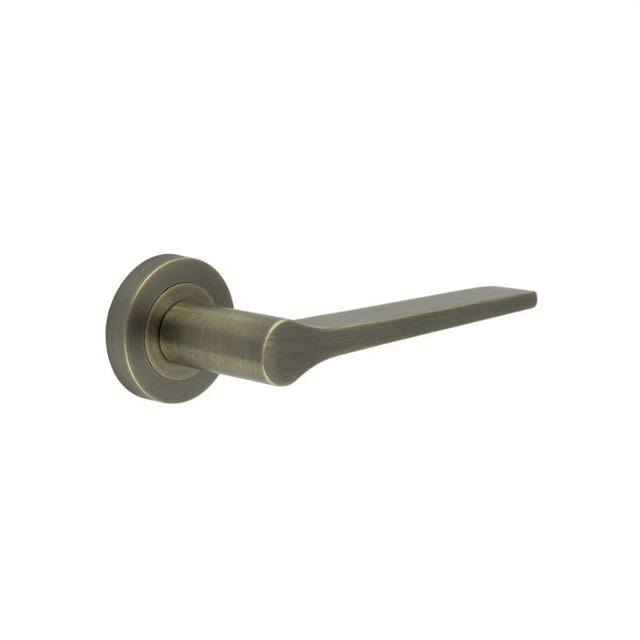 This is an image showing the Frelan - Geo Door Handle in Antique Brass available to order from Trade Door Handles in Kendal