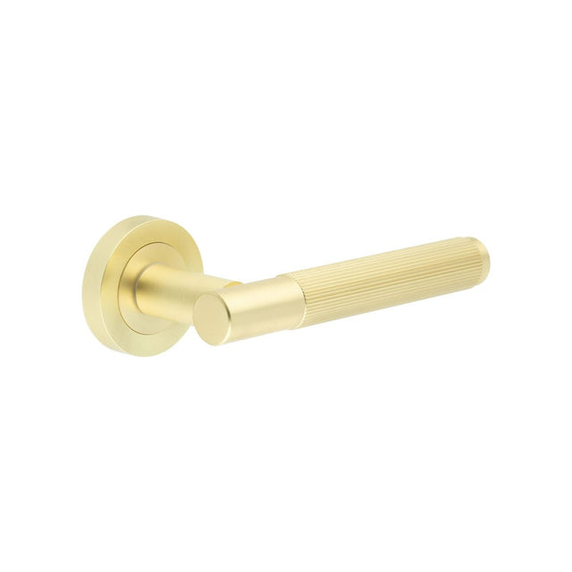 This is an image showing the Frelan - Venice Satin Brass Lever on rose available to order from Trade Door Handles in Kendal