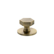Quality image of Millhouse Brass Pennington Hexagonal Cabinet Knob Handle on Backplate - Antique Brass | Sku. mhchb1532ab | available from Trade Door Handles.