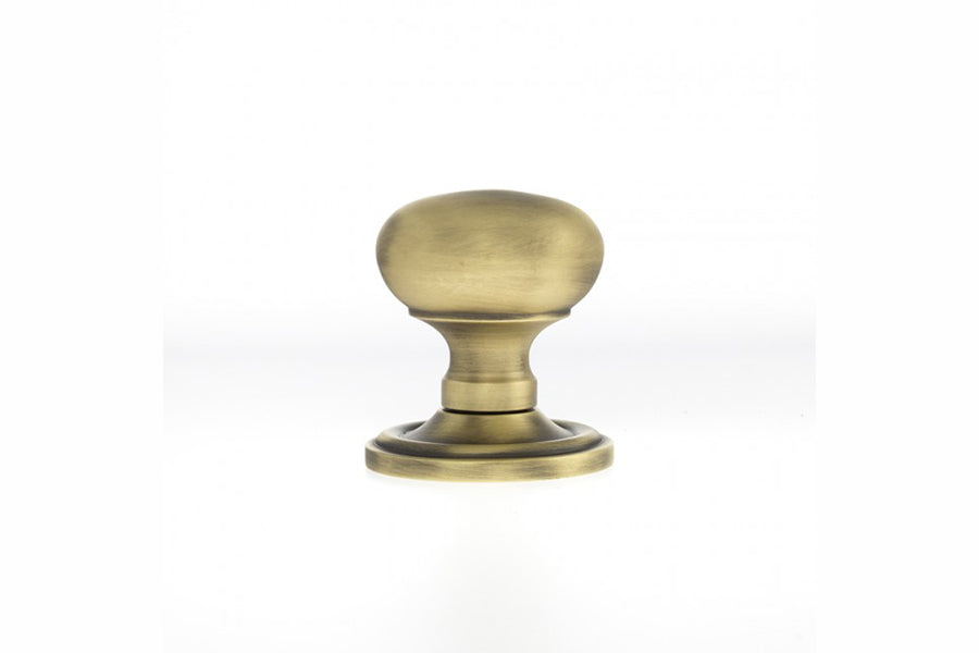 Quality image of Old English Harrogate Solid Brass Mushroom Mortice Knob on Concealed Fix Rose - Matt Antique Brass | Sku. oe58mmkmab | available from Trade Door Handles.