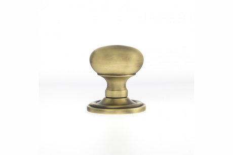 Quality image of Old English Harrogate Solid Brass Mushroom Mortice Knob on Concealed Fix Rose - Matt Antique Brass | Sku. oe58mmkmab | available from Trade Door Handles.