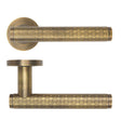 High quality image of the Rosso Maniglie - Favo Lever On Round Rose, Antique Brass Finish | Sku. rm170ab | available to order from Trade Door Handles.