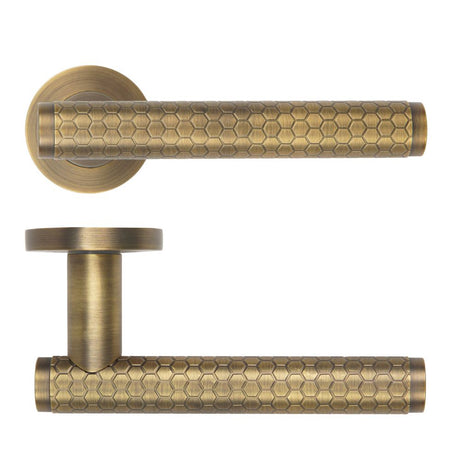 High quality image of the Rosso Maniglie - Favo Lever On Round Rose, Antique Brass Finish | Sku. rm170ab | available to order from Trade Door Handles.