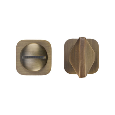 High quality image of the Rosso Tecnica - Turn and Release - Rosso Mini Squircle - Antique Brass | Sku. RT004-MINISQ-AB | available to order from Trade Door Handles.