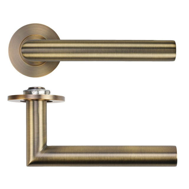 High quality image of the Rosso Tecnica - Lugano Lever on 4mm Round Slim Sprung Rose - Antique Brass | Sku. RT010-SLIM-AB | available to order from Trade Door Handles.