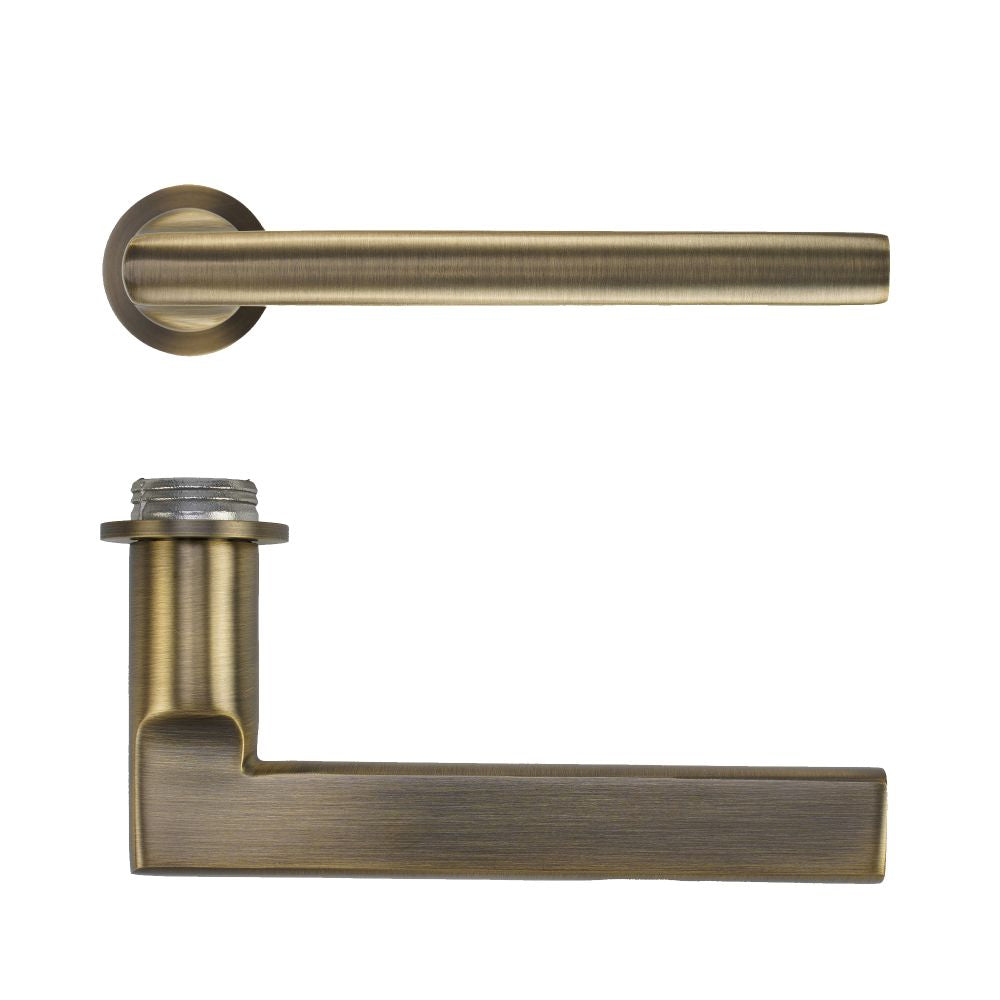 High quality image of the Rosso Tecnica - Varese Lever on 32mm Round Mini Rose - Antique Brass | Sku. RT040-MINI-AB | available to order from Trade Door Handles.