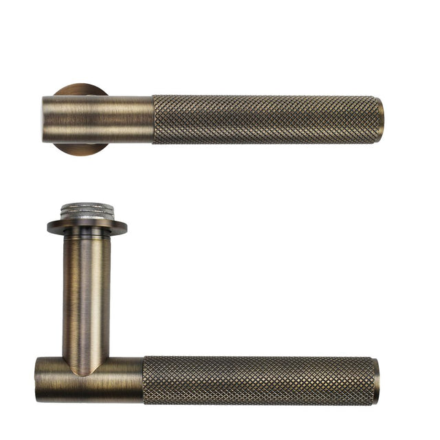 High quality image of the Rosso Tecnica - Orta Lever on 32mm Round Mini Rose - Antique Brass | Sku. RT060-MINI-AB | available to order from Trade Door Handles.