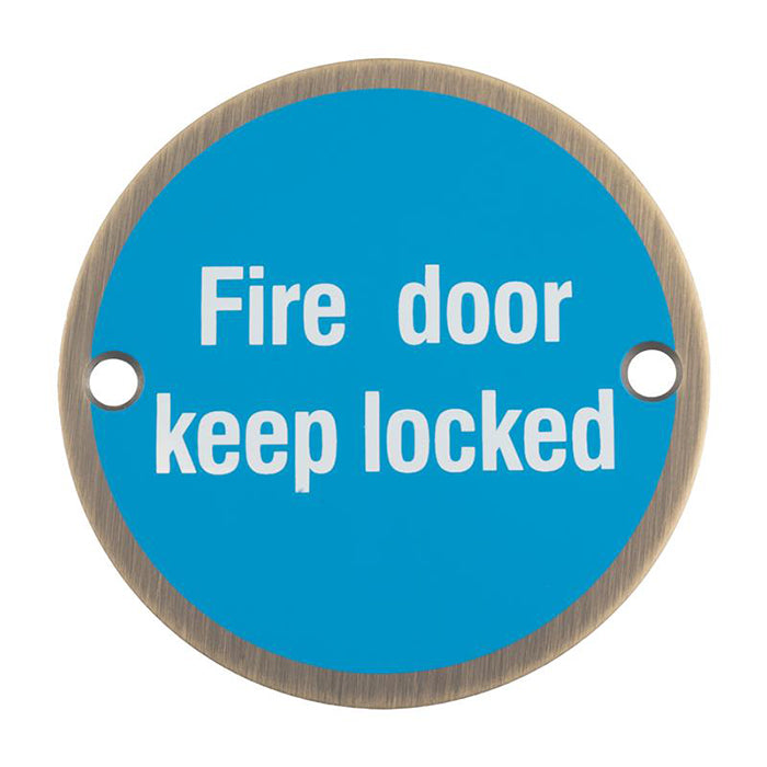 High quality image of Eurospec - Signage Fire Door - Keep Locked - Antique Brass | Sku. sex1015ab | available to order from Trade Door Handles in Kendal.