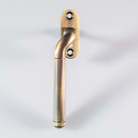 High quality image of Carlisle Brass - Cranked Locking Espagnolette Handle L/H - Florentine Bronze | Sku. v1008lhfb | Trade Door Handles.