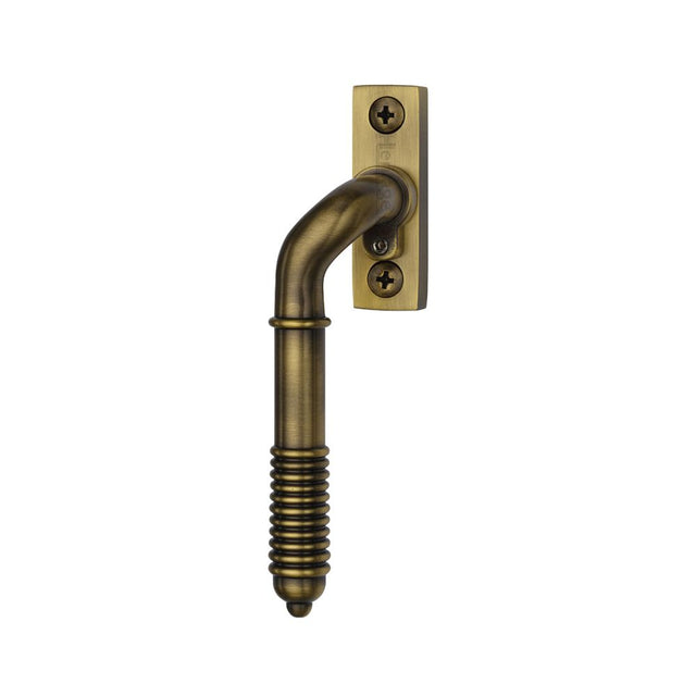 High quality image of Heritage Brass - Lockable Espagnolette Left Handed Reeded Design Antique Brass finish | Sku. v895l-lh-at | available to order from Trade Door Handles in Kendal.