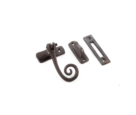 This is an image showing the Frelan - Valley Forge Curly Tail Casement Fastener - Beeswax available to order from Trade Door Handles in Kendal