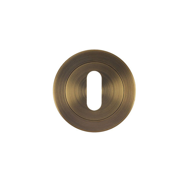 High quality image of the STANZA - Escutcheon Standard Profile (50mm Dia.) - Antique Brass | Sku. ZPA002-AB | available to order from Trade Door Handles.