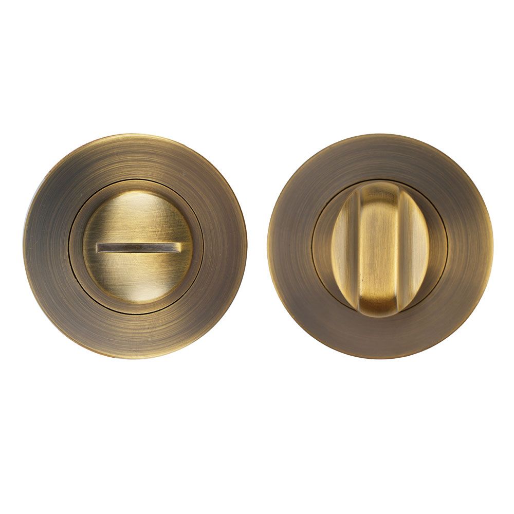 High quality image of the STANZA - Turn & Release on Round Rose - Antique Brass | Sku. ZPA004-AB | available to order from Trade Door Handles.