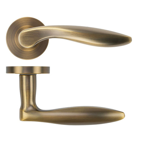 High quality image of the STANZA - Cadiz Lever on Rose - Antique Brass | Sku. ZPA060-AB | available to order from Trade Door Handles.