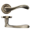 High quality image of the STANZA - Asti lever on round rose - Bronze | Sku. zpz230fb | available to order from Trade Door Handles.