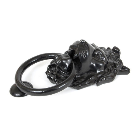 This is an image showing From The Anvil - Black Lion Head Door Knocker available from trade door handles, quick delivery and discounted prices