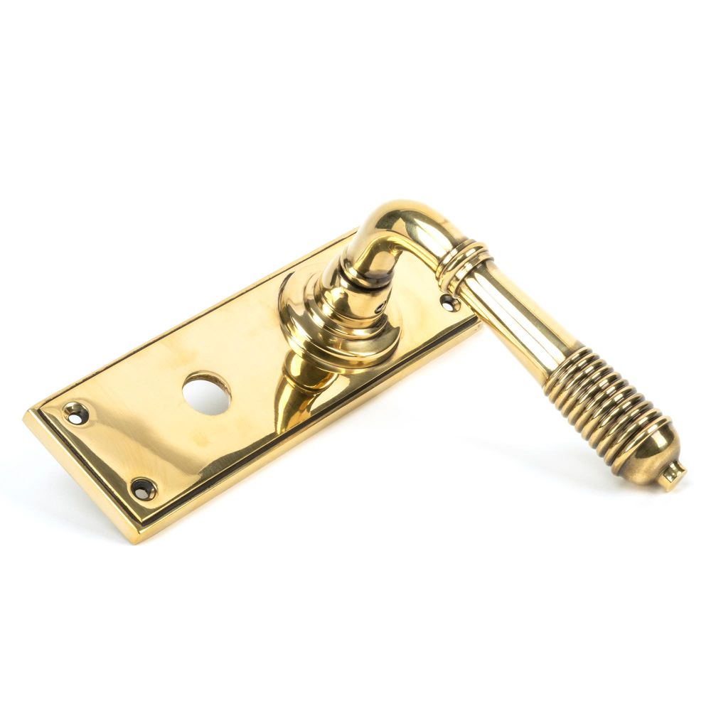 This is an image showing From The Anvil - Aged Brass Reeded Lever Bathroom Set available from trade door handles, quick delivery and discounted prices