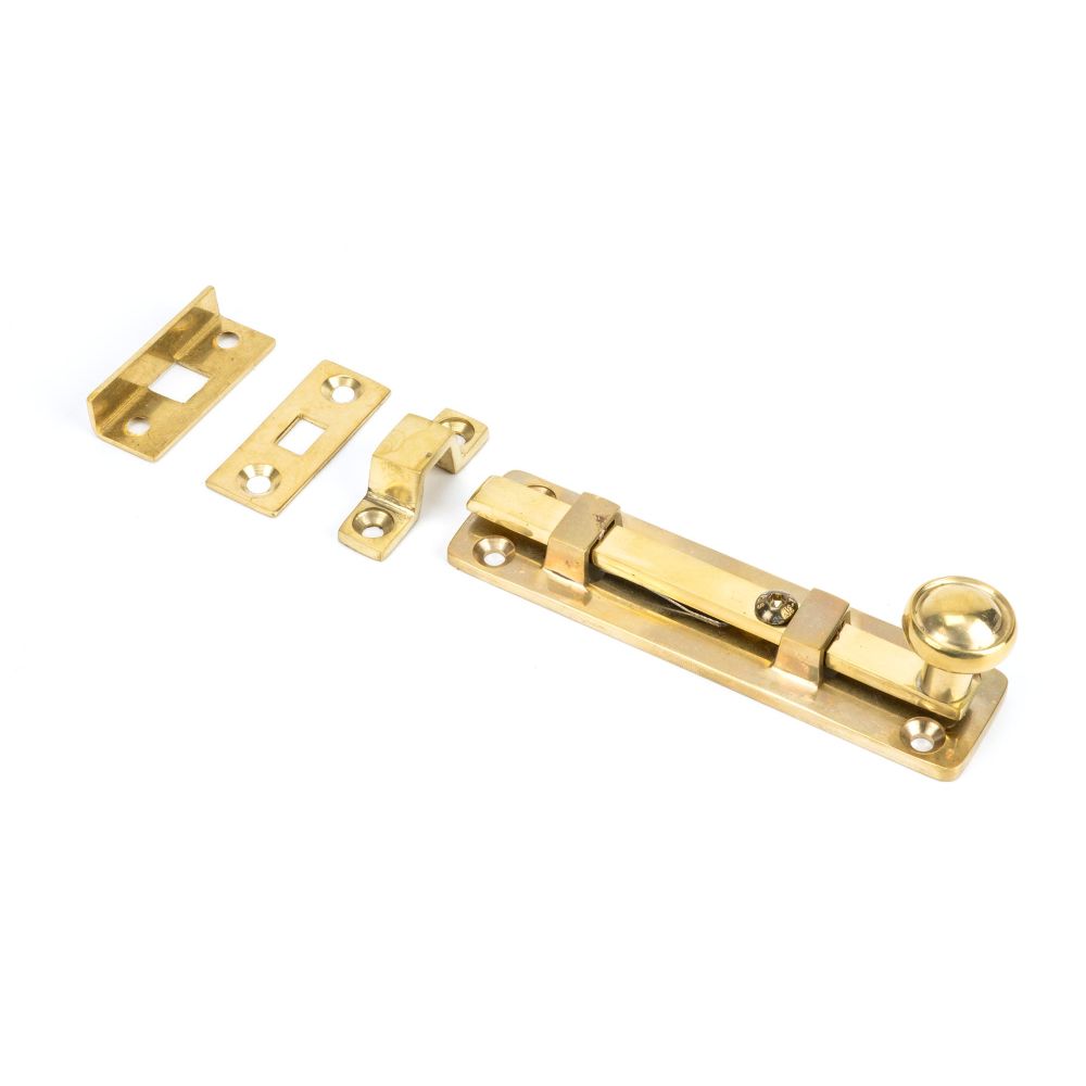 This is an image showing From The Anvil - Polished Brass 4" Universal Bolt available from trade door handles, quick delivery and discounted prices