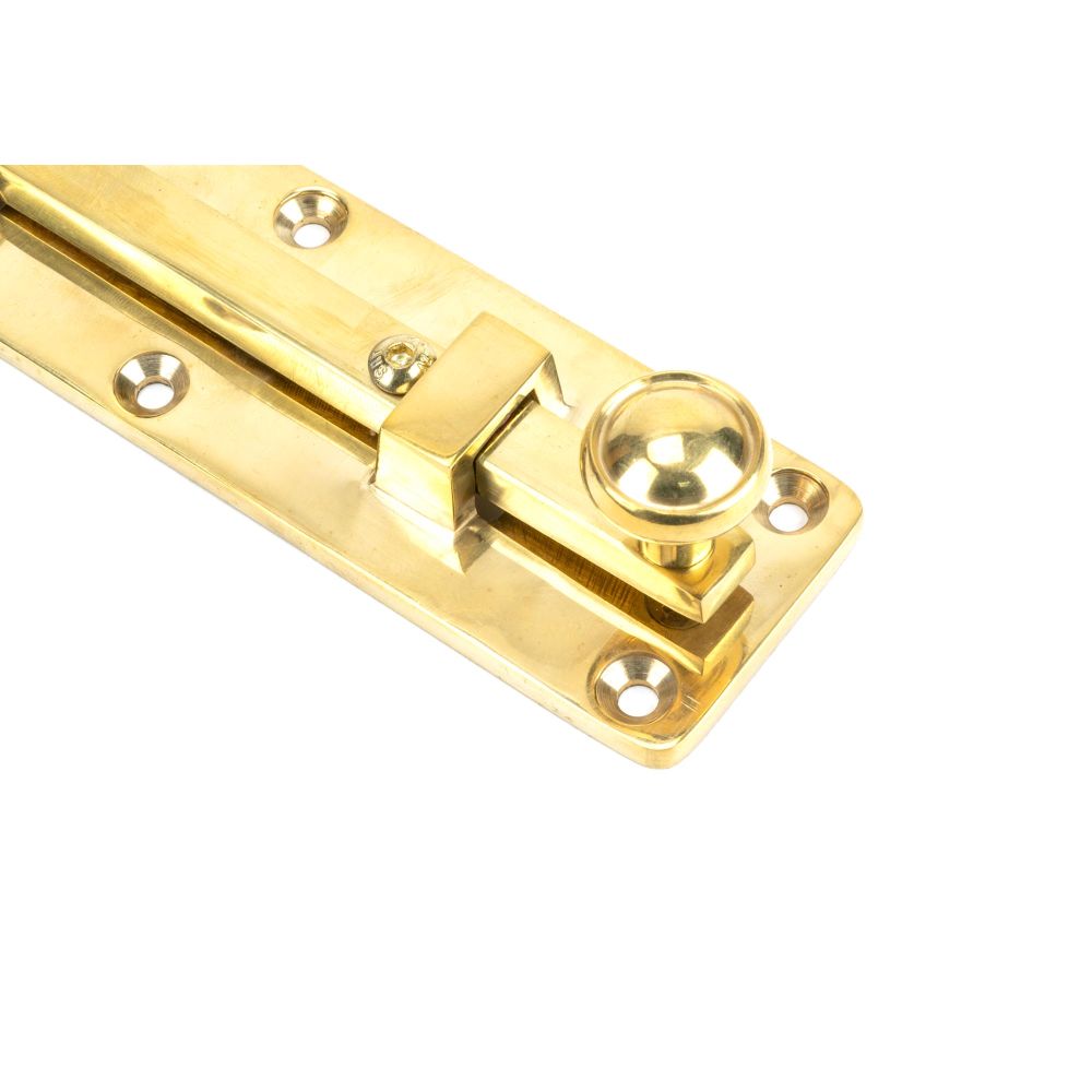 This is an image showing From The Anvil - Polished Brass 6" Universal Bolt available from trade door handles, quick delivery and discounted prices