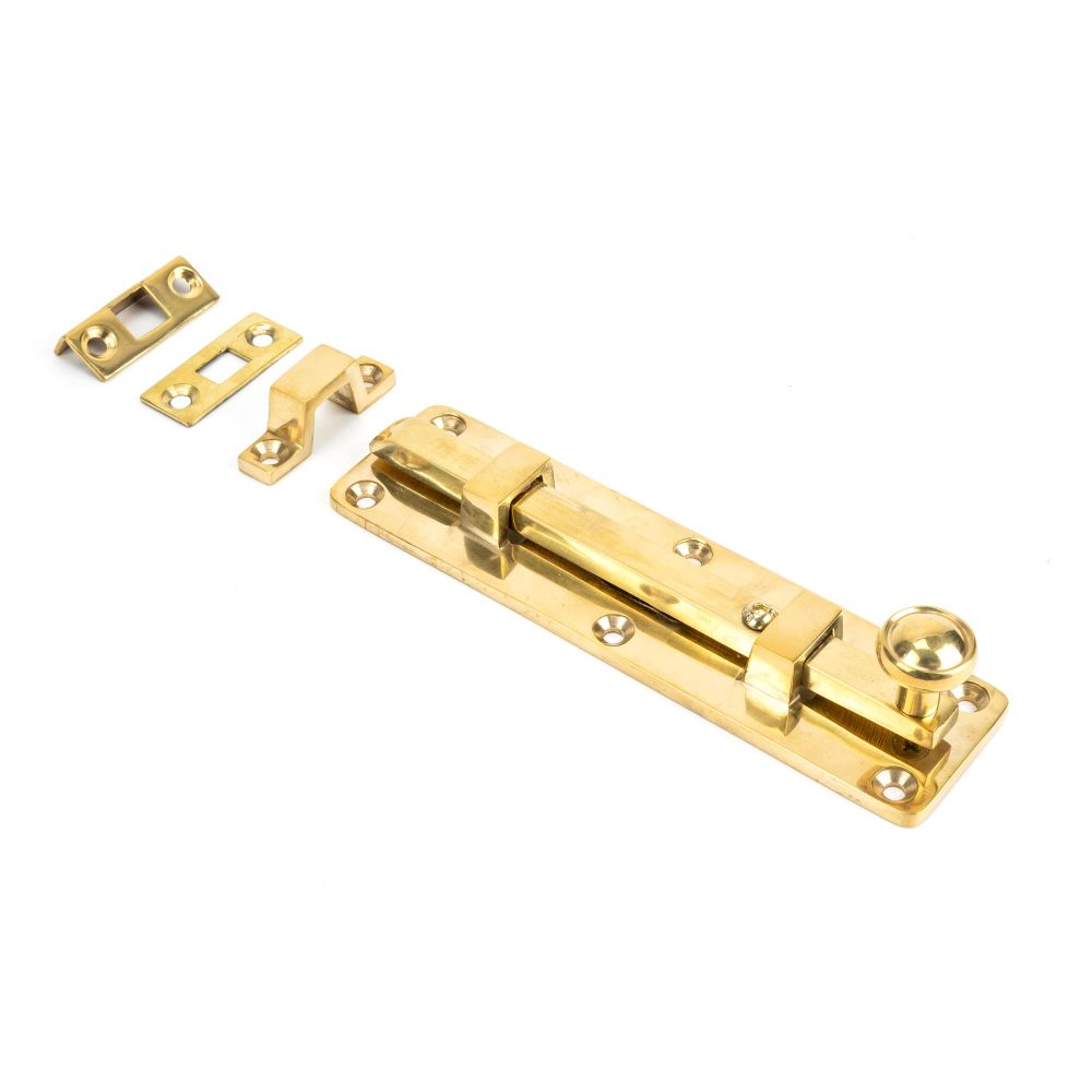 This is an image showing From The Anvil - Polished Brass 6" Universal Bolt available from trade door handles, quick delivery and discounted prices