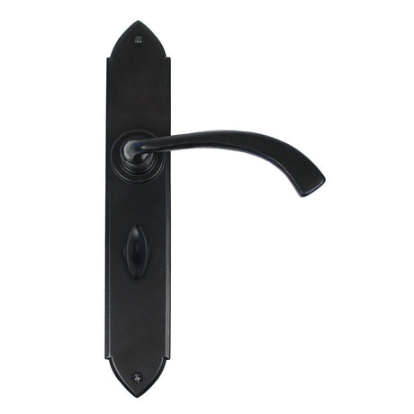 This is an image showing From The Anvil - Black Gothic Curved Sprung Lever Bathroom Set available from trade door handles, quick delivery and discounted prices