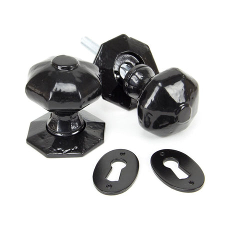 This is an image showing From The Anvil - Black Octagonal Mortice/Rim Knob Set available from trade door handles, quick delivery and discounted prices