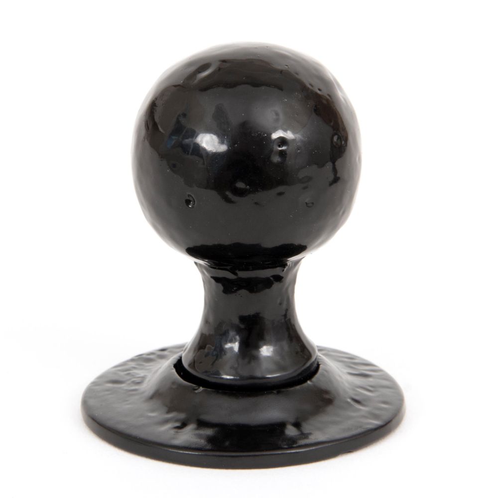 This is an image showing From The Anvil - Black Round Mortice/Rim Knob Set available from trade door handles, quick delivery and discounted prices