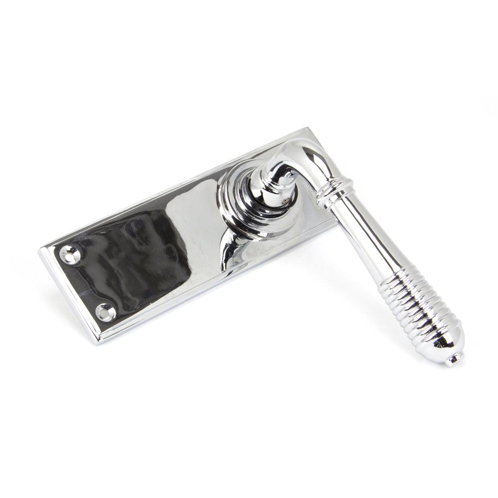 This is an image showing From The Anvil - Polished Chrome Reeded Lever Latch Set available from trade door handles, quick delivery and discounted prices