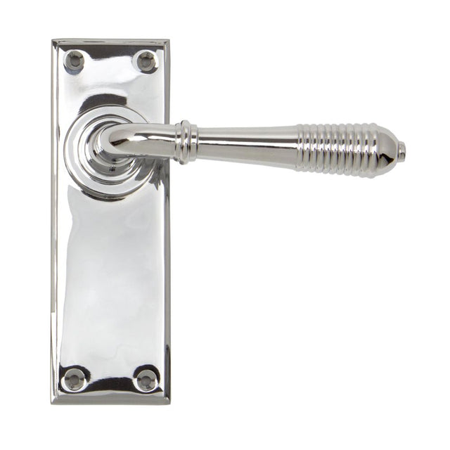 This is an image showing From The Anvil - Polished Chrome Reeded Lever Latch Set available from trade door handles, quick delivery and discounted prices