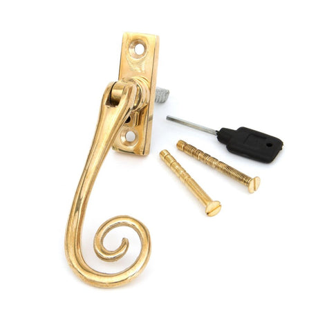 This is an image showing From The Anvil - Polished Brass Slim Monkeytail Espag - RH available from trade door handles, quick delivery and discounted prices