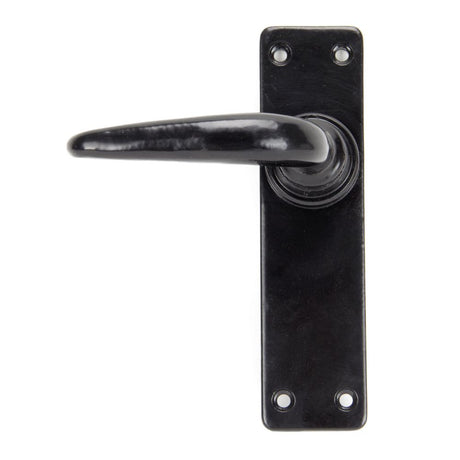 This is an image showing From The Anvil - Black Smooth Lever Latch Set available from trade door handles, quick delivery and discounted prices