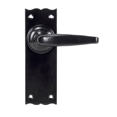 This is an image showing From The Anvil - Black Oak Lever Latch Set available from trade door handles, quick delivery and discounted prices