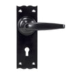 This is an image showing From The Anvil - Black Oak Lever Lock Set available from trade door handles, quick delivery and discounted prices