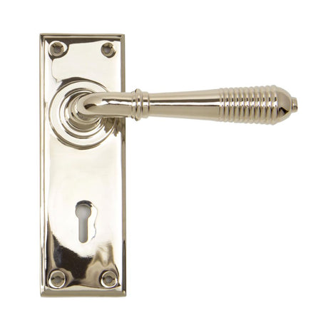 This is an image showing From The Anvil - Polished Nickel Reeded Lever Lock Set available from trade door handles, quick delivery and discounted prices