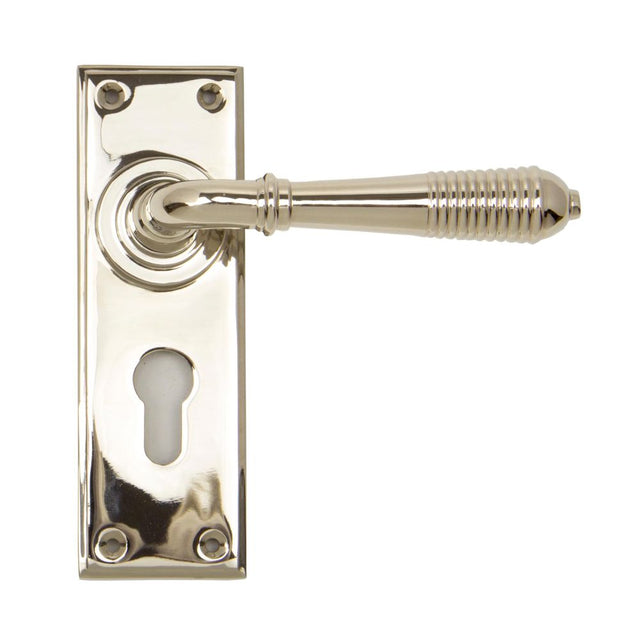 This is an image showing From The Anvil - Polished Nickel Reeded Lever Euro Lock Set available from trade door handles, quick delivery and discounted prices