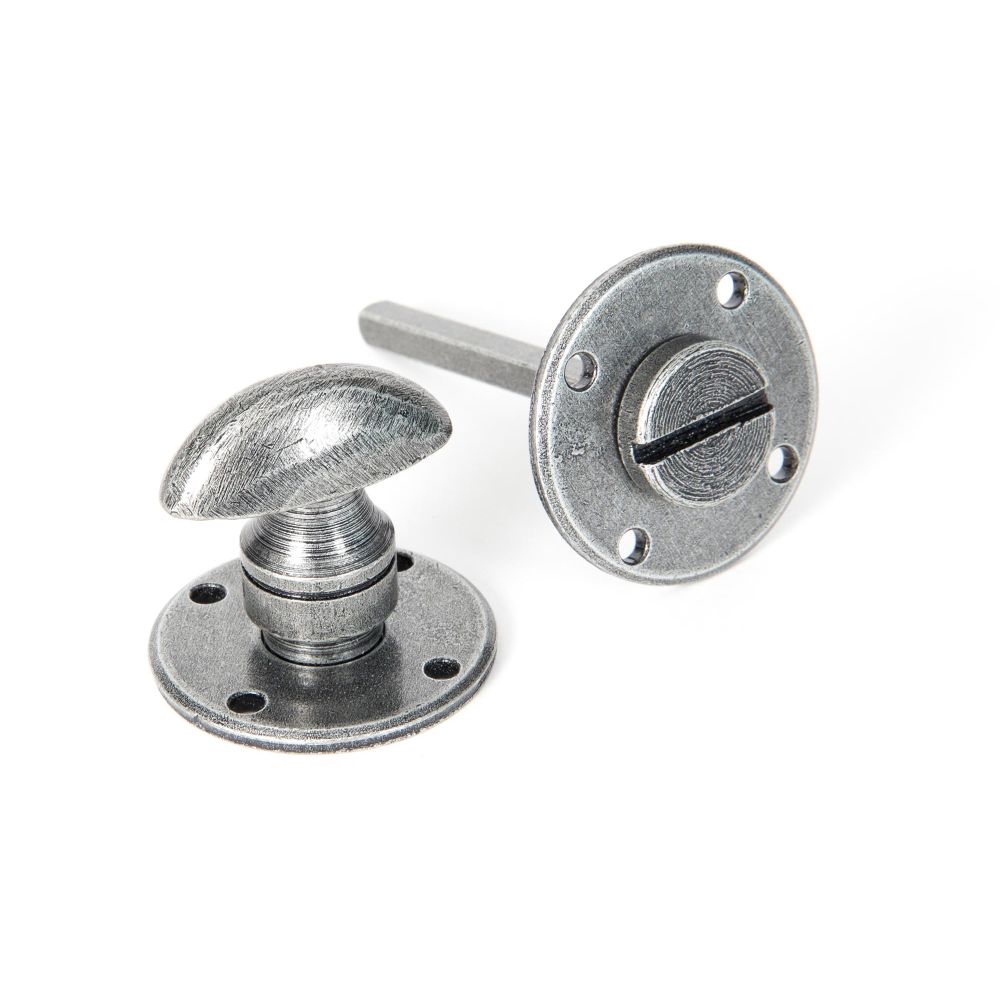 This is an image showing From The Anvil - Pewter Round Bathroom Thumbturn available from trade door handles, quick delivery and discounted prices