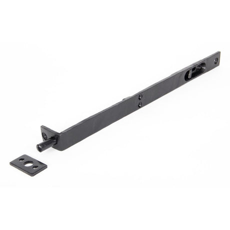 This is an image showing From The Anvil - Black 12" Flush/Slide Door Bolt available from trade door handles, quick delivery and discounted prices