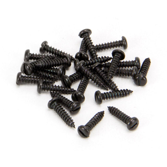 This is an image showing From The Anvil - Black 4 x 1/2" Round Head Screws (25) available from trade door handles, quick delivery and discounted prices