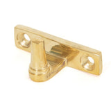 This is an image showing From The Anvil - Polished Brass Cranked Stay Pin available from trade door handles, quick delivery and discounted prices